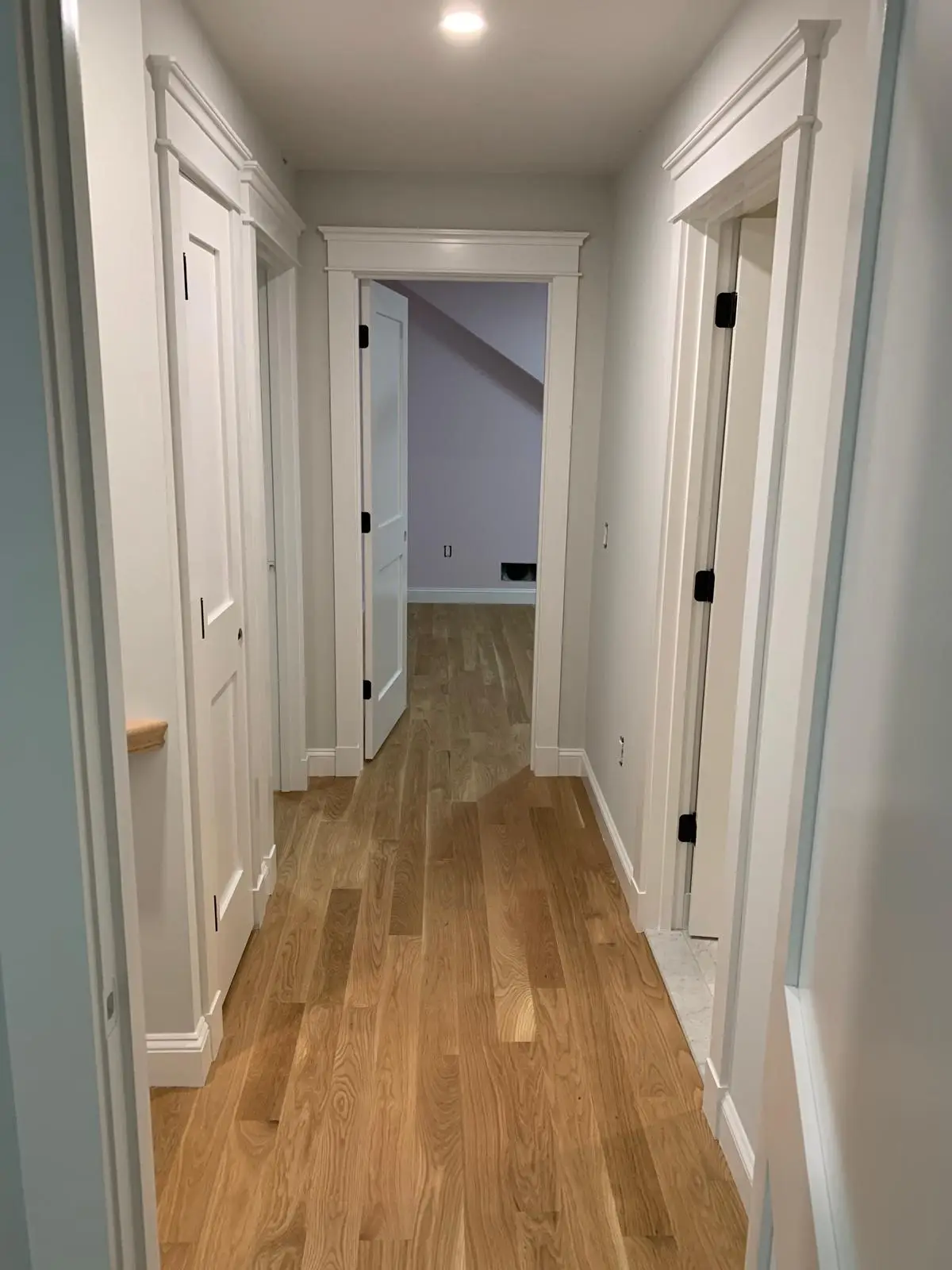 Trim and finish painting service for residential interiors, highlighting precise craftsmanship and clean, detailed work. The process includes careful surface preparation, sanding, caulking, priming, and smooth paint application on baseboards, crown molding, window and door trims, frames, and detailed finishes. Crisp, sharp lines and a refined look that elevate the overall design, add contrast, and enhance the value of your space. Professional trim painting, finish painting, detailed interior painting, residential painting services, home improvement, baseboard painting, crown molding painting, door and window trim painting, high-end finishes, clean and professional results, premium materials, licensed painters, Massachusetts painting company, Cape Cod finish painting, flawless results.
